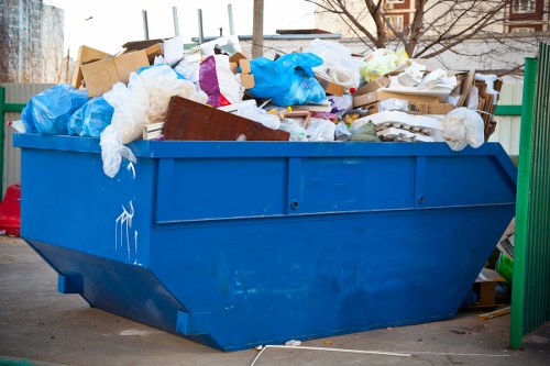 Man and van removing bulky household waste from a detached home